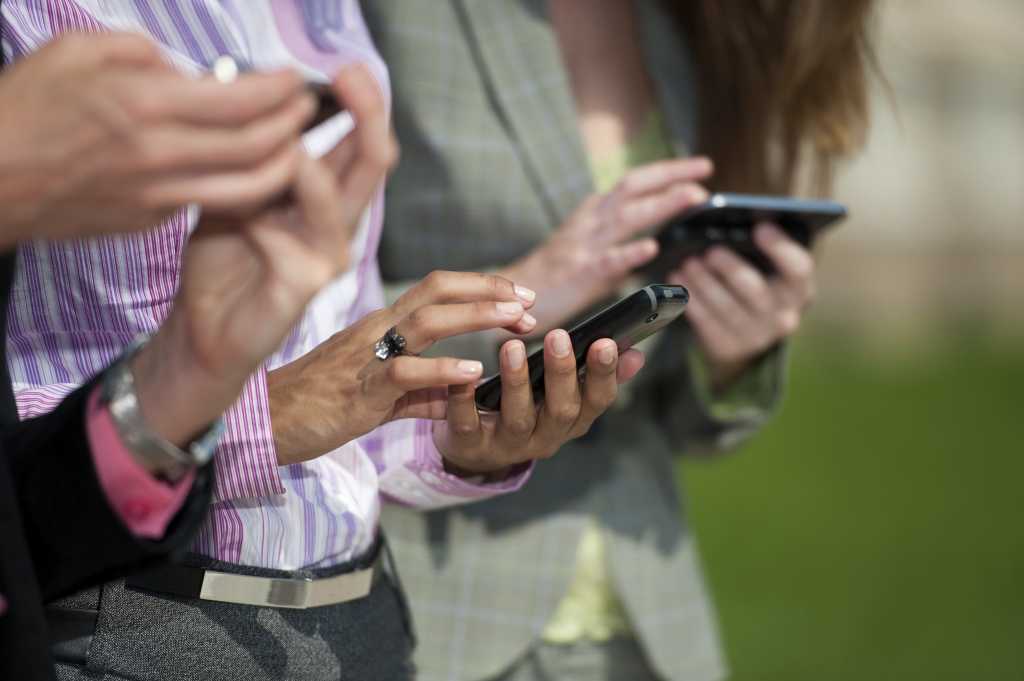 Three businesswomen texting 153967692