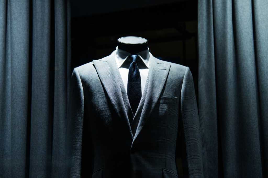 business savvy cio suit tailor maniquin unknown headless businessman