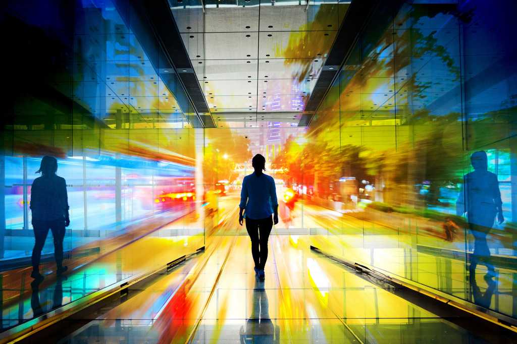 Conceptual images of an executive as she walks the path forward into the light.