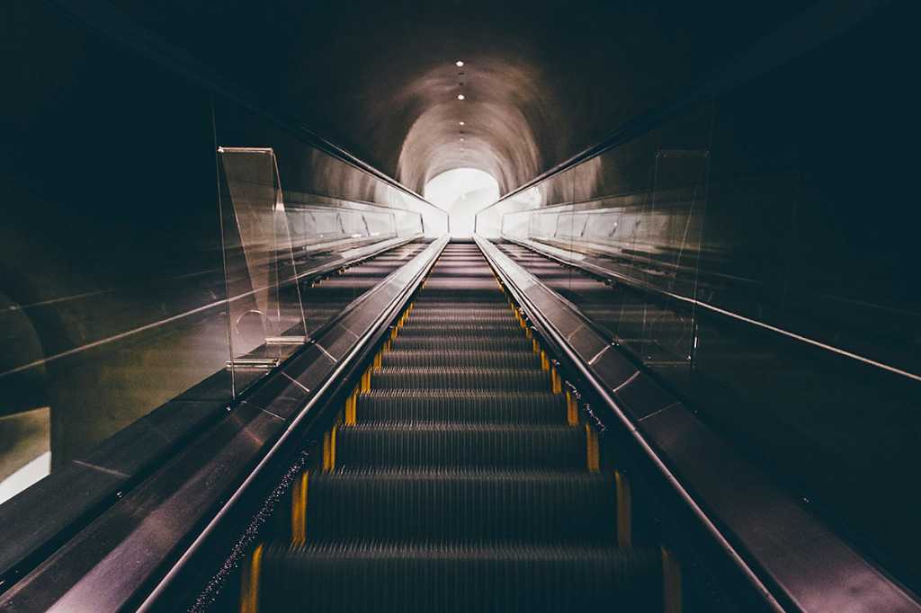 escalator / stairs / steps / tunnel / rise / progress / path