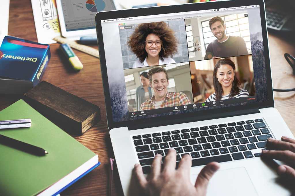 Zoom video conferencing > One user connected via laptop showing a grid of remote participants.