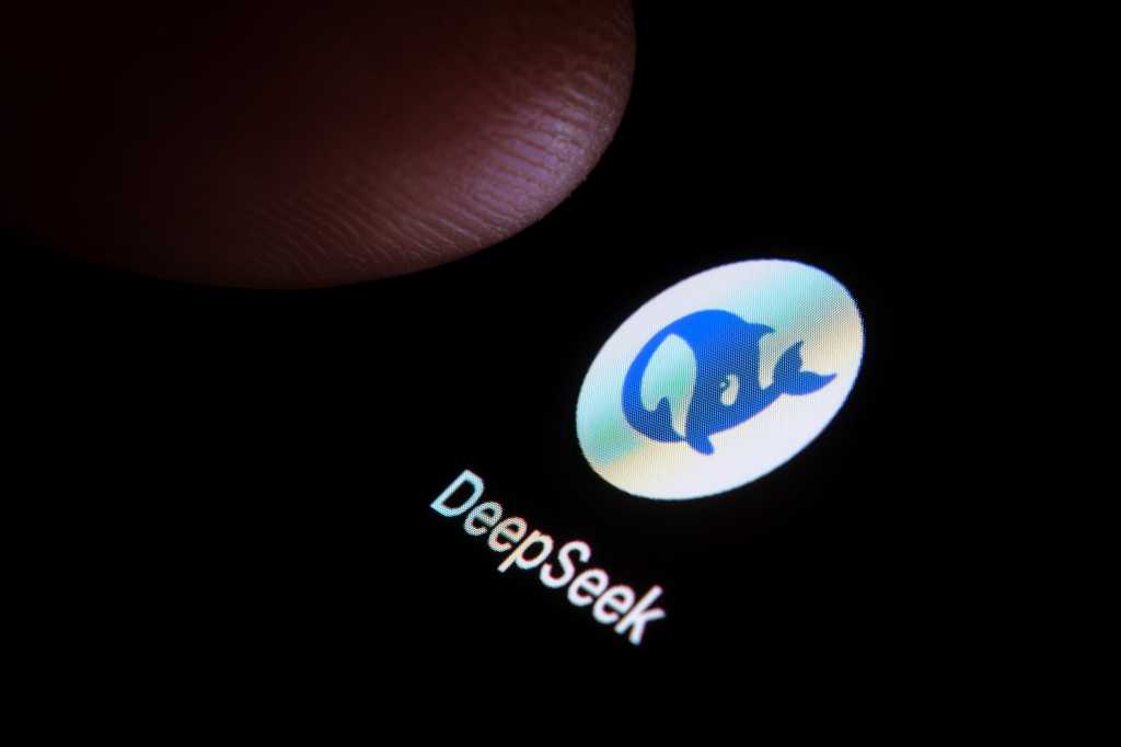 DeepSeek AI app seen on the smartphone and finger is about to touch it.