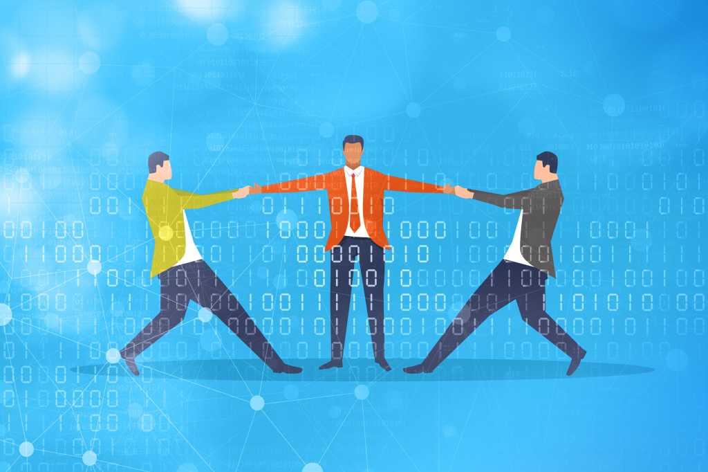 Demand for talent  >  Two business people compete for a third in a tug of war