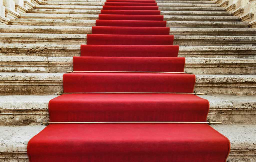 Ancient stairs covered with red carpet