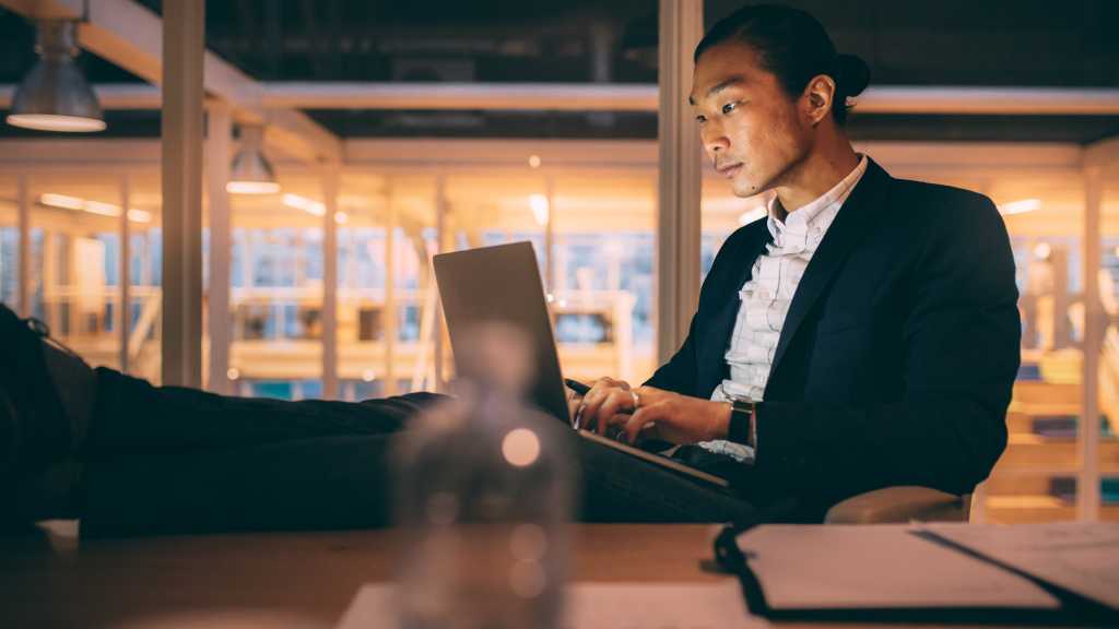 tech executive sitting alone in conference room